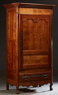 French Provincial Carved Cherry Bonnetiere, early 19th c., the stepped canted corner crown over a two panel door with long iron fiche hinges and escut
