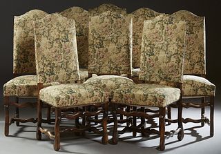 Set of Eight French Louis XV Style Upholstered Side Chairs, early 20th c., the arched canted high backs over trapezoidal seats, on cabriole legs joine