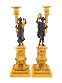 A Pair of Charles X Style Gilt and Patinated Bronze Figural Candlesticks