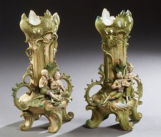 Pair of German Polychromed Figural Bisque Flare Vases, late 19th c., Saxony, the pierced scalloped rims over tapered baluster bodies with applied hand