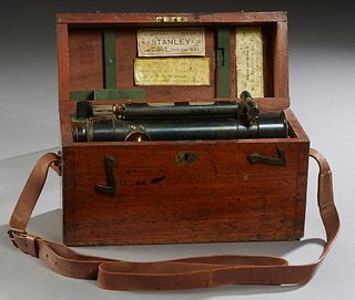 Brass Surveyor's Transit, 19th c., by W. F. Stanley, London, in the original fitted mahogany carrying case, with a folding mahogany tripodal stand, th