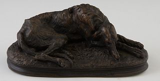 After Paul Gayrard (1807-1855), "Sleeping Borzoi," 20th c., patinated bronze, on an integral oval base, H.- 2 3/4 in., W.- 6 in., D.- 2 5/8 in.