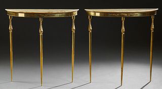 Pair of Brass Louis XVI Style Marble Top Console Tables, 20th c., the demilune creme marble over an ormolu mounted skirt, on turned tapered reeded leg