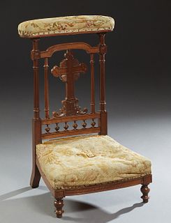 French Provincial Carved Walnut Prie Dieu, 19th c., with a padded armrest over a cruciform back splat, to a bowed seat, on turned legs, in original ne
