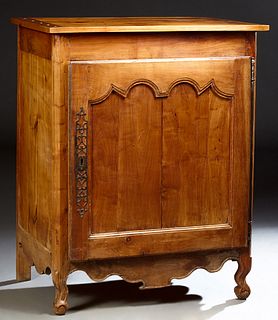 French Provincial Louis XV Style Carved Cherry Confiturier, 19th c., the rectangular top over a large arched panel door with a long iron fiche hinge o