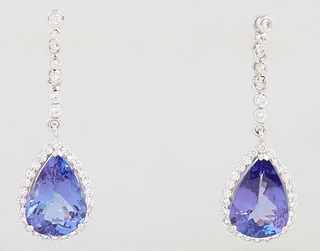 Pair of Platinum Pendant Earrings, with a diamond mounted stud issuing a diamond mounted link chain, to a pear shaped 2.74 ct. tanzanite, atop a borde
