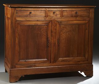 French Provincial Louis Philippe Carved Walnut Sideboard, 19th c., the rounded corner top over three frieze drawers and double cupboard doors, on a st