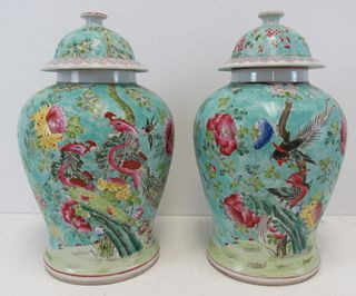 A Pair Of Chinese Enamel Decorated Lidded Jars.