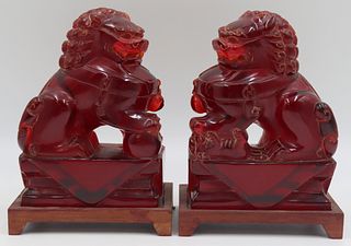 Pair of Carved Cherry Amber? Foo Dogs on Stands.