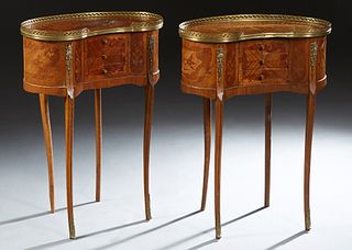 Pair of French Ormolu Mounted Louis XV Style Marquetry Inlaid Nightstands, early 20th c., of kidney form, the top with a pierced brass gallery, over t