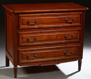 French Louis XVI Style Carved Cherry Commode, 20th c., the stepped rounded corner top over three drawers, flanked by reeded pilasters, on tapered reed