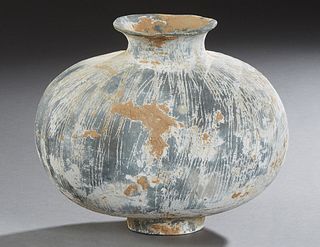 Chinese Han Dynasty Pottery Cocoon Jar, c. 200 B.C., of oval form, with an everted neck, and incised and  paint decoration, H.-  9 1/2 in., W.-  11 1/