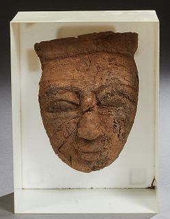 Egyptian Carved Wooden Mummy Mask, c. 1100 A.D., presented in a tin and lucite shadowbox frame, H.- 8 1/2 in., W.- 6 in., D.- 5 in.