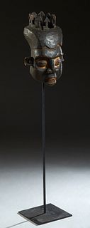 Large African Carved Wood King's Mask, early 20th c., with remnants of a crown, and articulated teeth, on a wood and iron floor stand, Mask- H.- 21 in
