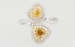 Lady's 14K White Gold Dinner Ring, the bypass band with two fancy yellow and fancy brown pear shaped diamonds, within heart shaped double concentric b