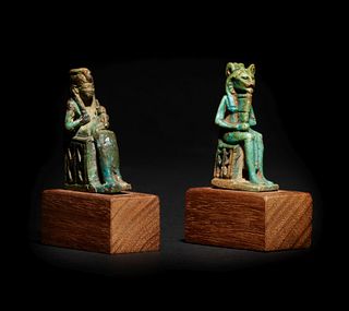 An Egyptian Faience Isis and Horus and an Egyptian Faience Sekhmet 
Height of taller example 2 1/8 inches; height of shorter example 2 inches.