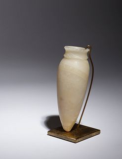An Egyptian Alabaster Vessel
Height 5 3/8 inches.