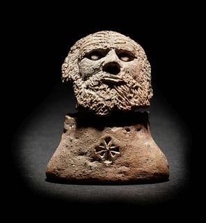 A Romano-Egyptian Terracotta Male Head
Height 2 inches.