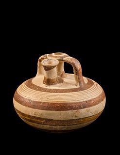 A Mycenaean Pottery Stirrup Jar
Height 4 1/2 inches.