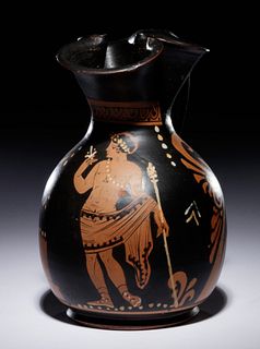 A Paestan Red-Figured Trefoil Oinochoe with a Standing Male FigureHeight 7 1/4 inches.