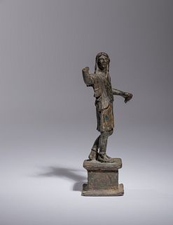 A Roman Bronze Figure of a Man
Height 5 5/8 inches.