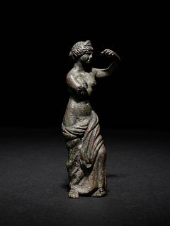 A Roman Bronze Figure of Venus
Height 3 5/16 inches.