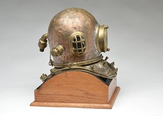 Brass and copper dive helmet with face.