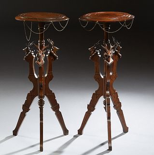 Pair of American Carved Mahogany Pedestals, late 19th c., possibly Cincinnati, the incised top draped with looped metal chains, on a turned support is