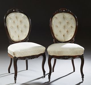 Pair of American Louis XV Style Upholstered Side Chairs, late 19th c., the leaf and floral carved crestrail over a tufted upholstered medallion back, 