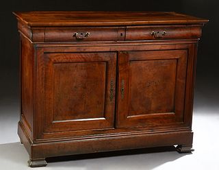 French Provincial Louis Philippe Carved Walnut Sideboard, 19th c., the rounded corner top over two convex frieze drawers, above double cupboard doors,