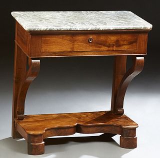 French Louis Philippe Carved Walnut Marble Top Console Table, 19th c., the highly figured rounded edge and corner top over a frieze drawer on scrolled