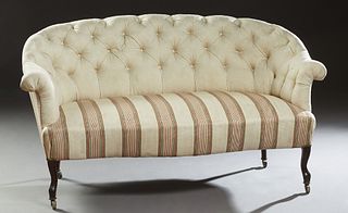 French Louis XV Style Carved Beech Settee, c. 1870, the curved arched tufted wraparound back and arms to a serpentine seat, on cabriole legs with cast
