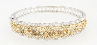 18K White and Yellow Gold Hinged Bangle Bracelet, the scalloped top with a yellow gold center band with 22 fancy yellowish brown, yellowish orange and