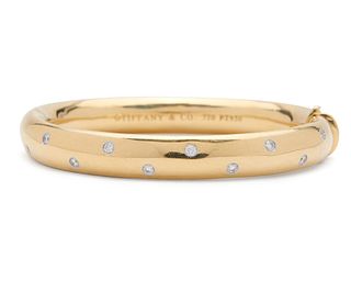 TIFFANY & CO. 18K Gold, Platinum, and Diamond "Etoile" Bangle Bracelet