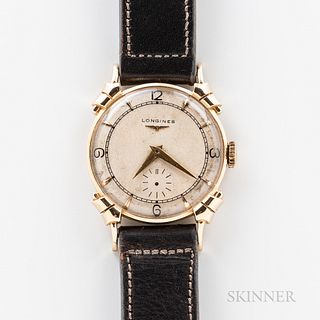 Longines "Fancy Lug" 14kt Gold Wristwatch, c. 1950s, ivory-tone dial with applied gilt indices, and black printed arabic numerals, appl