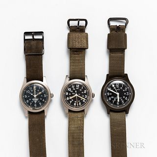 Three Military Wristwatches, green plastic molded Timex with black dial and lollipop sweep center seconds; Hamilton Mil-spec H3 46374B,