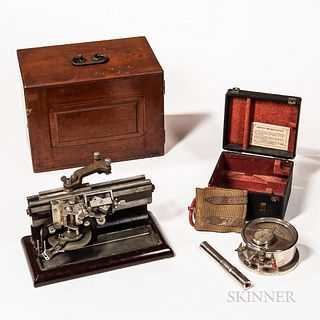 Two Early Scientific Instruments, Bausch & Lomb cherry cased Mikrotome number 2080 on a painted cast iron base, and a cased Oscillometr