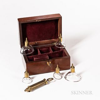 19th Century Cased Dry Cupping Set, c. 1850, mahogany fitted case with burgundy velvet-lined interior, five glass oval mouth cups with