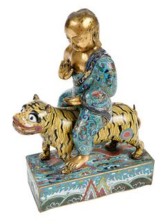 A Chinese Cloisonne Figure Riding a Tiger