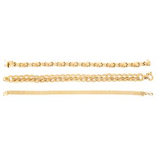 A Trio of 14K Yellow Gold Link Bracelets