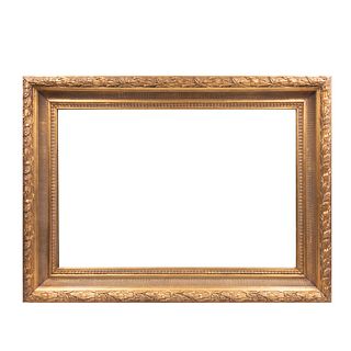 Espejo. SXX. Elaborado en madera estucada y dorada. Con luna rectangular. Decorado con elementos vegetales y molduras. 113 x 84 x 8 cm