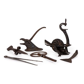 A Cast Iron Table-Top Nut Cracker and Other Iron Implements