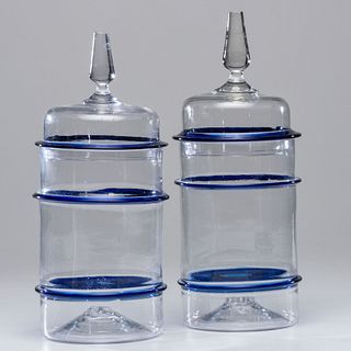 A Pair of Large Blown Blue and Clear Glass Canisters