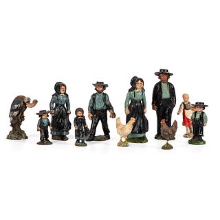 Eleven Toy Figurines, Including Seven Cast Iron Amish Figures