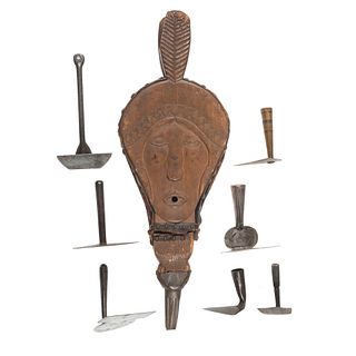 A Group of Hand-Forged Hearth Rakes and Figural Wooden Bellows