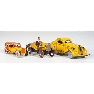 A Wolverine Mystery Car and Two Wind-Up Tin Toy Cars