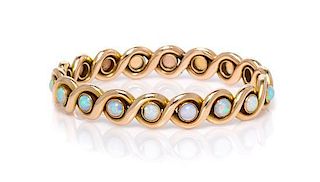 * A Yellow Gold and Opal Bangle Bracelet, 19.10 dwts.