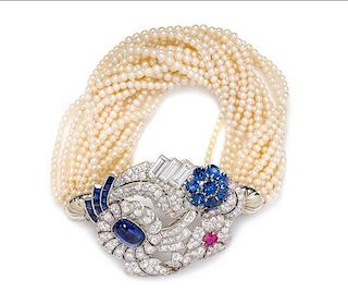 A Convertible Platinum, Gold, Sapphire, Ruby, Diamond and Seed Pearl Brooch/Bracelet, Raymond Yard, 12.60 dwts.