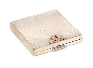 A Sterling Silver, 14 Karat Yellow Gold and Ruby Compact, Tiffany & Co., 54.50 dwts.