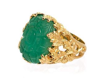 * An 18 Karat Yellow Gold and Carved Emerald Ring, 6.70 dwts.